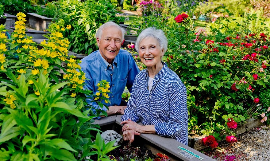 senior couple outside gardening
