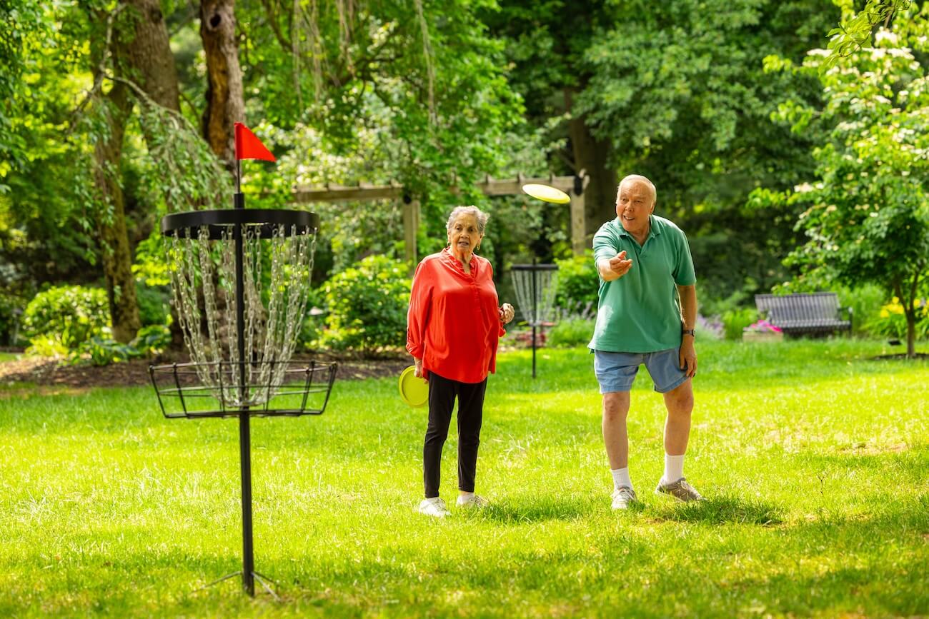 two residents playing frisbee golf