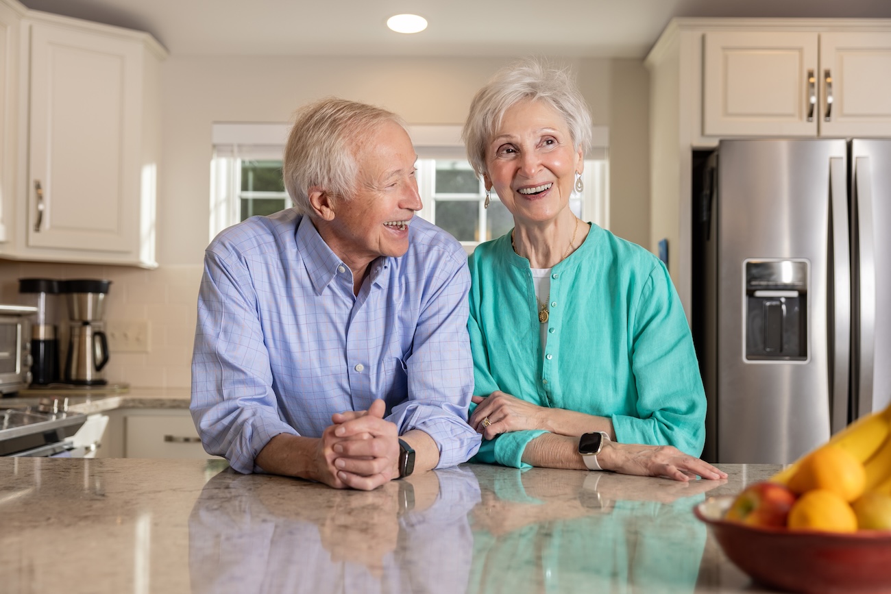 couple in kitchen smiling