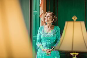 woman resident in green room at the Mansion