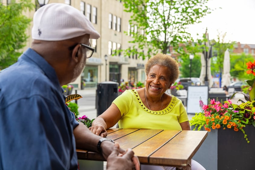 couple at table smiling