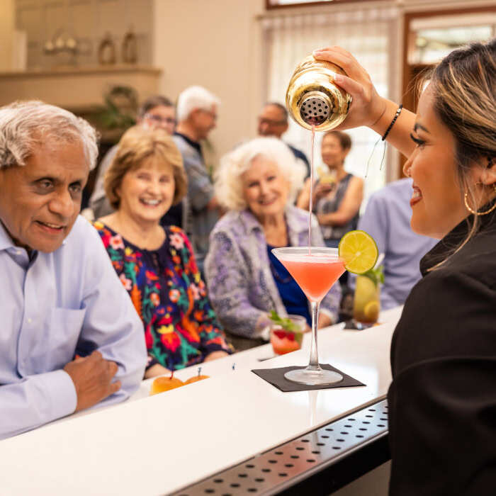 Bartender making a drink for a Regents Point resident