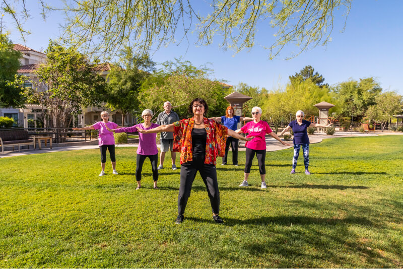 Group of seniors taking an outdoor exercise class