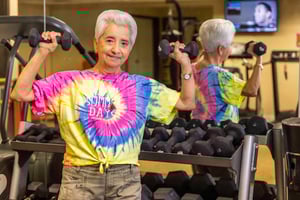 Senior woman working out in fitness center