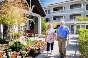 Senior couple holding hands on a walk