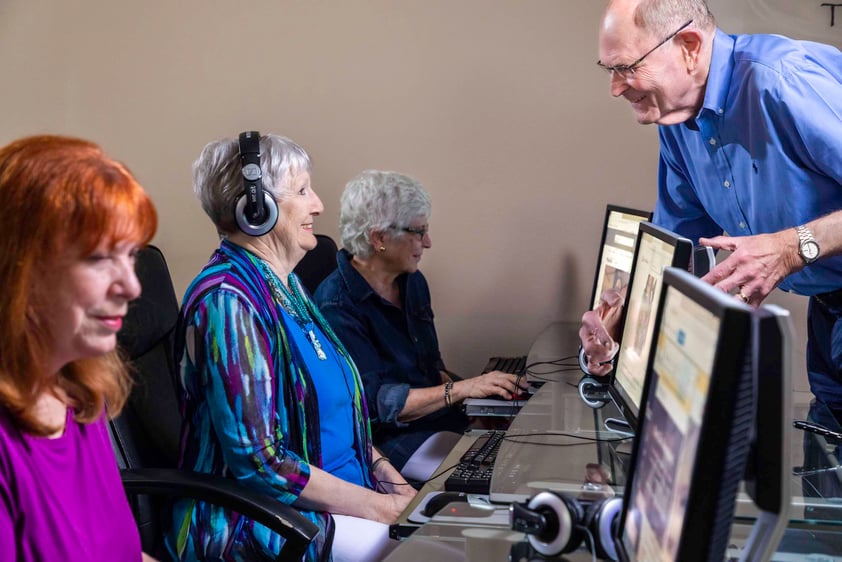Seniors taking a computer class
