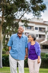 Senior couple holding hands in park