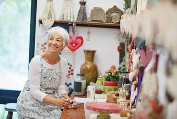 Senior woman painting in art studio