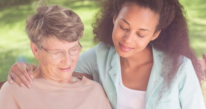 Grandmother and granddaughter sitting together