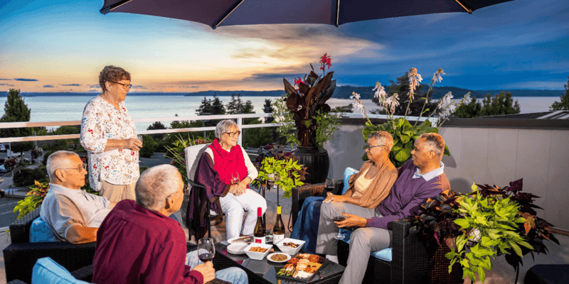 residents enjoying drinks and company out on rooftop patio