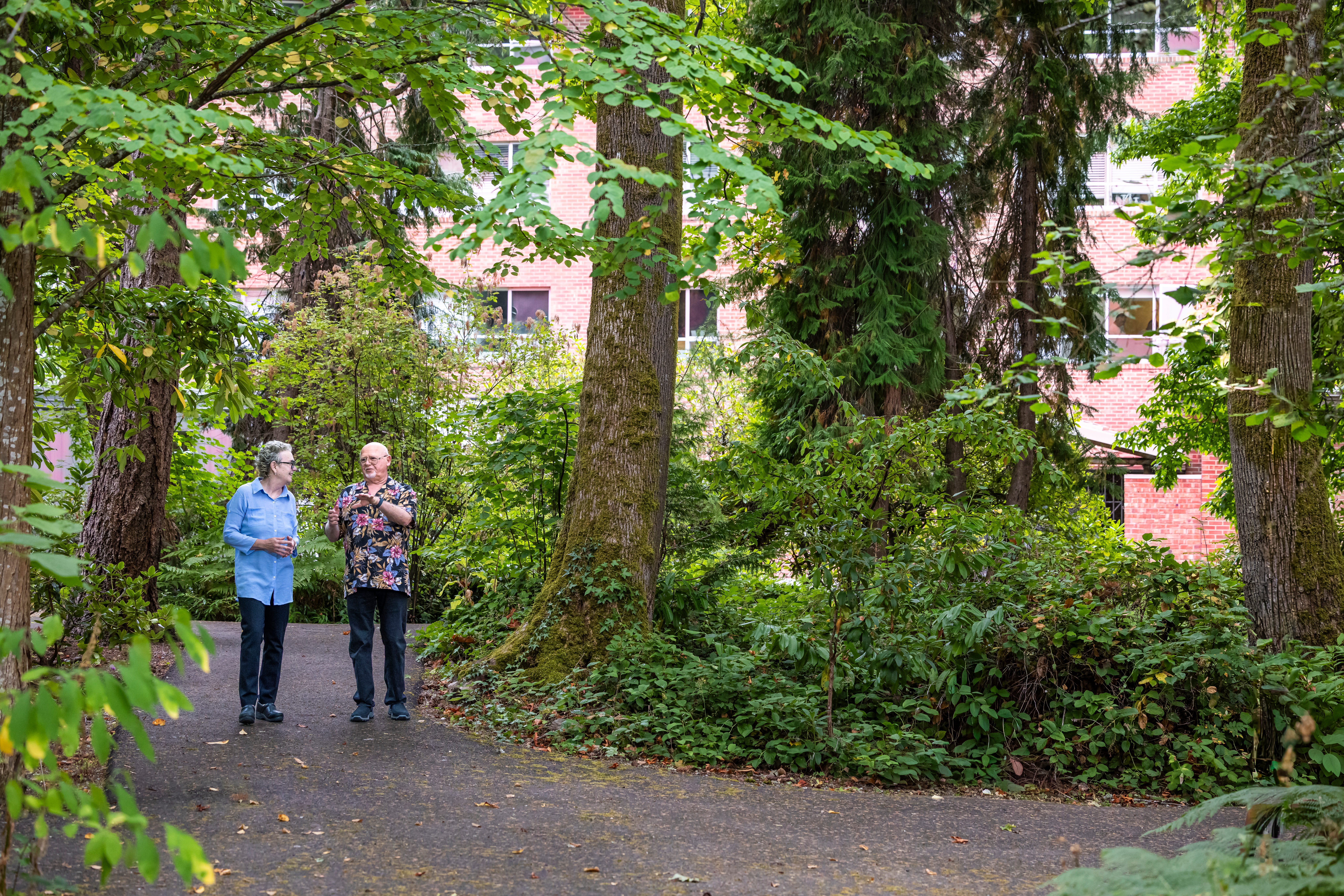 Senior women walking on a path outdoors