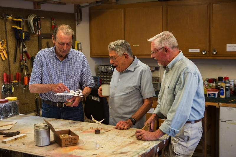 senior men in a woodworking workshop