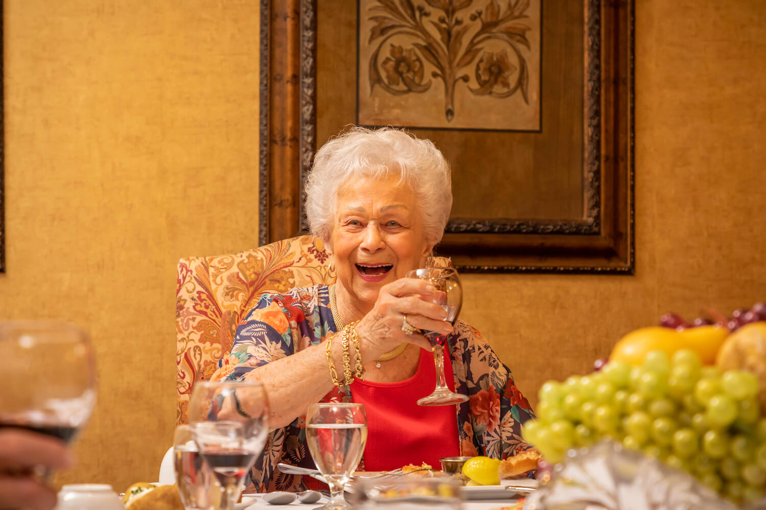 21-dining - woman raising a glass