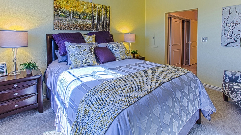  bedroom, yellow walls, focus on bed