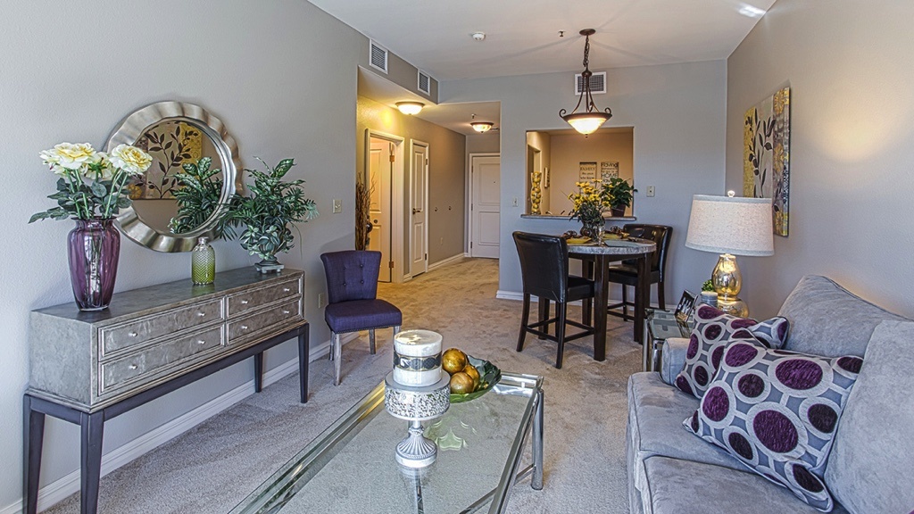  smaller living/dining room, purple circles on pillow