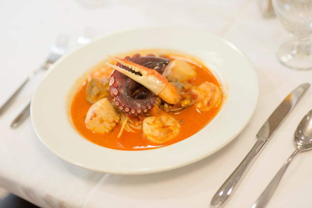 A plate with a seafood entree