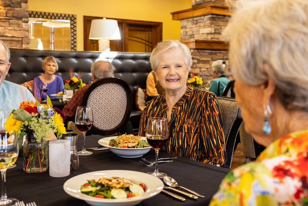 Two women eating dinner in a dining room