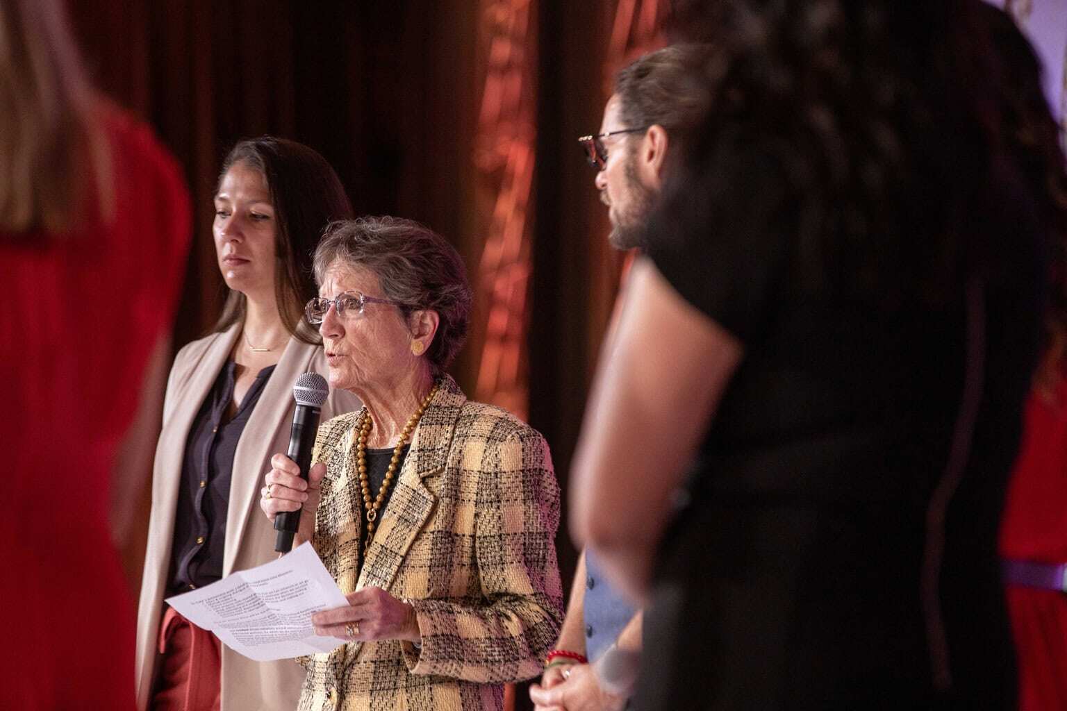 Woman speaking into a microphone