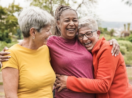Three women hugging