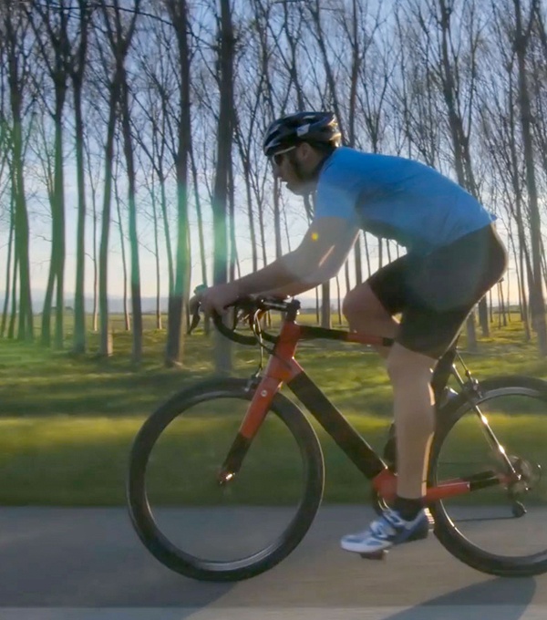 Guy riding a bicycle outside