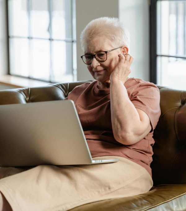 Woman reading on a laptop