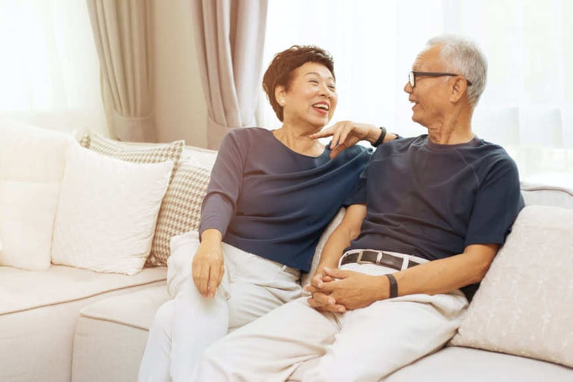 couple on couch laughing
