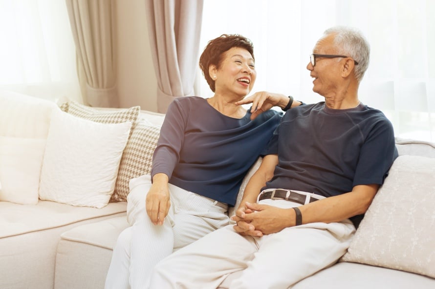 couple on couch laughing