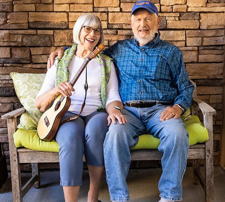 Tom and Mary sitting on a bench