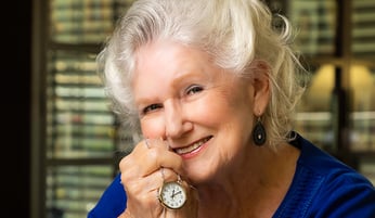 Vivian holding a pocket watch