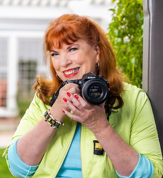 Mary holding a digital camera