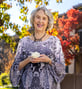 Donna, a senior woman, holding a flower