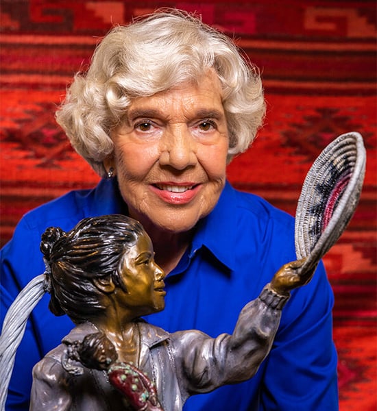 Ruth posing next to sculpture