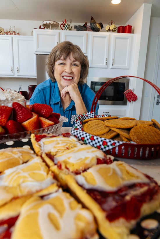 Peggy taking a picture with her freshly baked pastries.