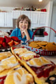 Peggy taking a picture with her freshly baked pastries.