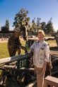 Jean feeding a giraffe 
