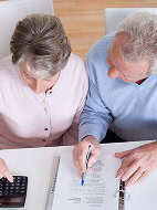 Man and woman working at a desk together
