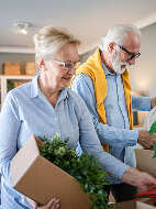 Man and woman packing boxes