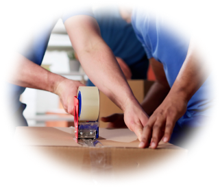 Two people taping up a moving box
