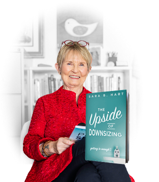 Sara B. Hart holding her book, "The Upside of Downsizing: Getting to Enough"