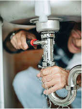 Man fixing a sink