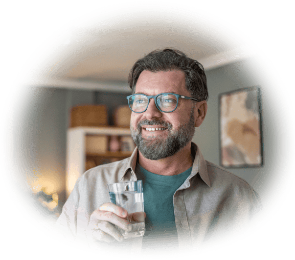Man holding a glass of water