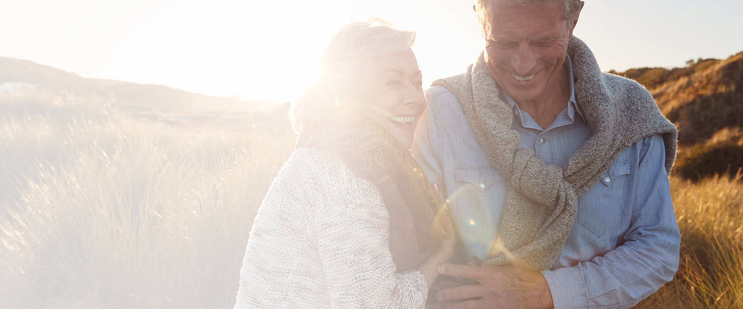 Man and woman walking in a field