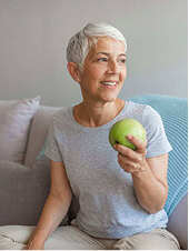 Woman holding an apple