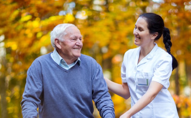 Man walking with a nurse