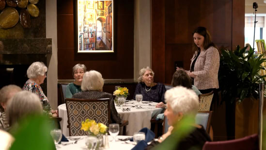 Groups of people sitting at dinner tables