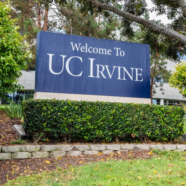 Blue sign with text that says Welcome to UC Irvine