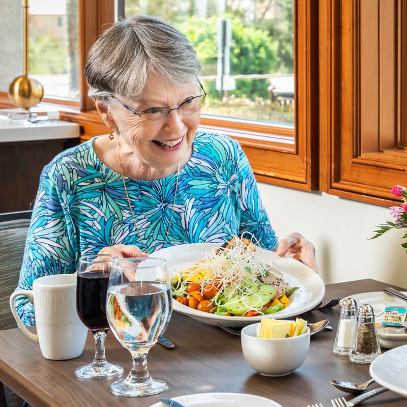 Senior woman enjoying freshly prepared meal