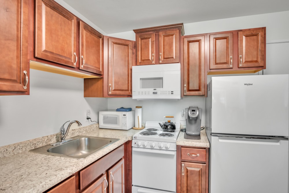 Kitchen with sink, oven, microwave, and refrigerator