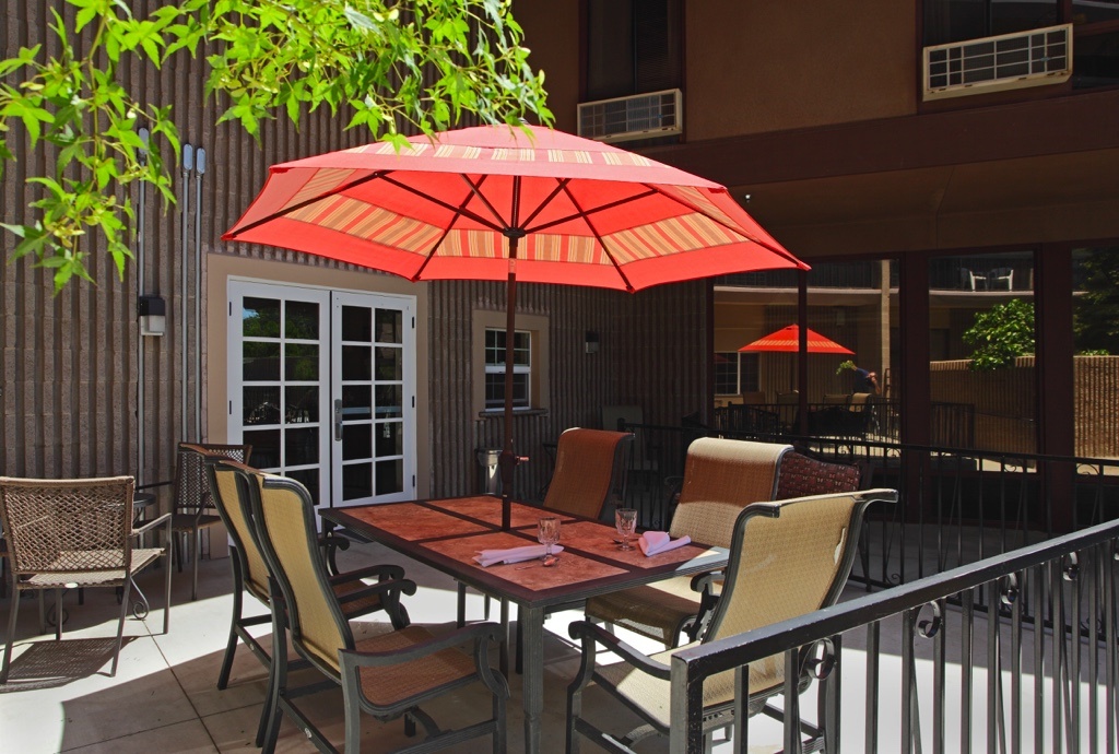 Outside table with red umbrella