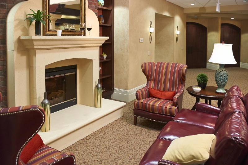Seating area with a fireplace in a common area at The Terraces at San Joaquin Gardens